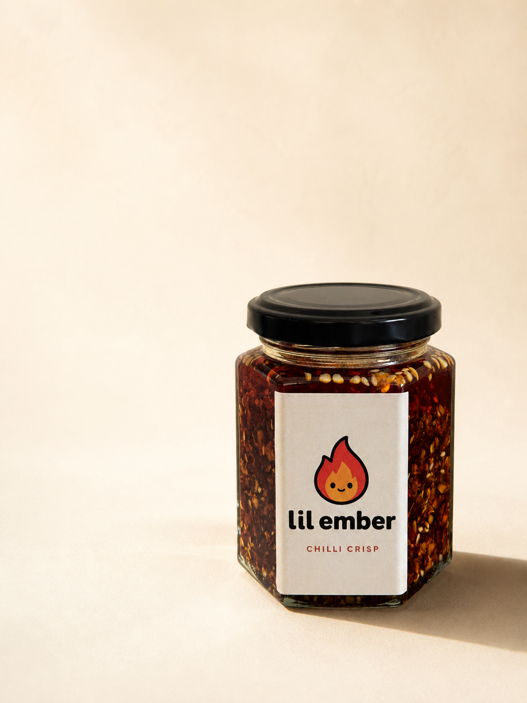 Lil Ember product campaign image in the warm cream studio